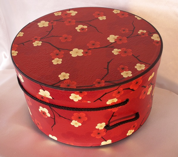 A free 12" hatbox packed with 4 large sized hand made ornaments 